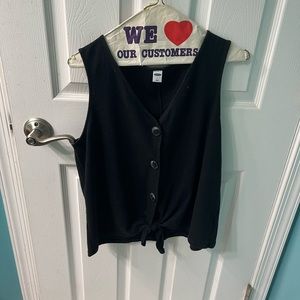black tank top with buttons and a bow at the bottom